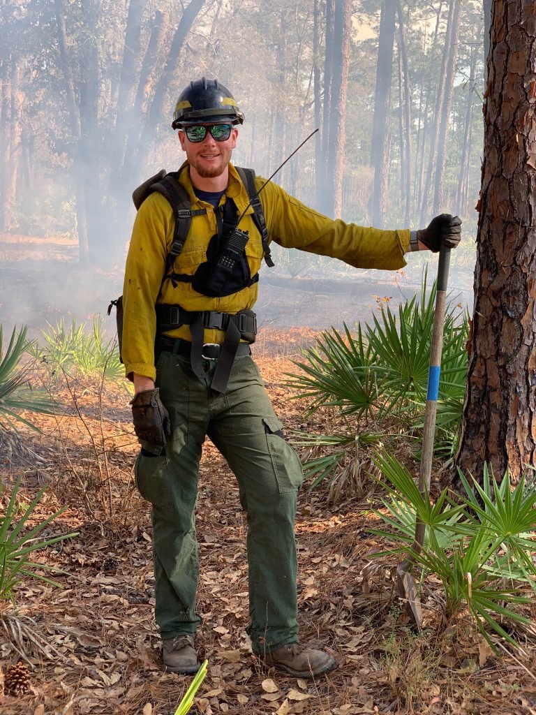 Stephen Wasp, graduate teaching assistant pursuing a master’s degree in forest resources and conservation, wearing fire PPE in the field.